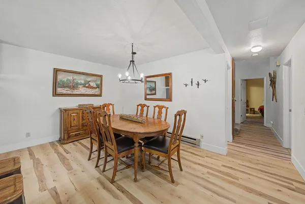 a kitchen with a refrigerator a sink and dishwasher with a dishwasher next to a window