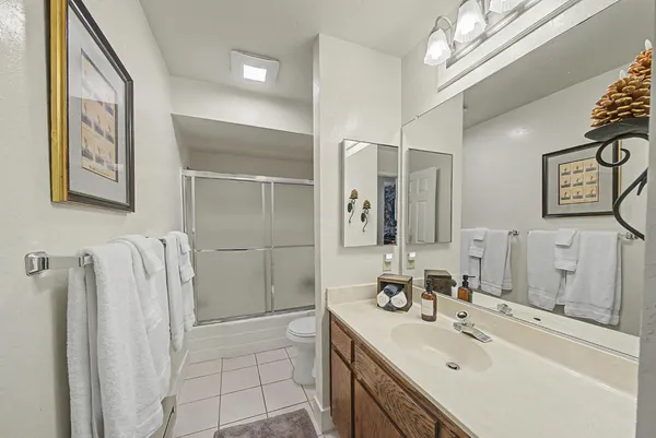 a room with a sink and cabinets