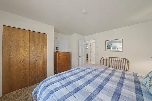 a view of an house with backyard space and balcony