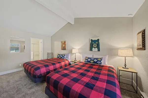 a view of a house with a large window and a yard