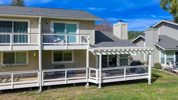 a view of a city with lush green forest