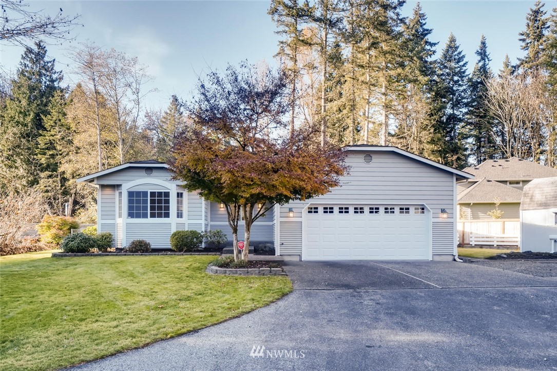 22007 4th Avenue Southeast Bothell, WA 98021 - Photo 1 of 22 a view of a house with a yard and large tree
