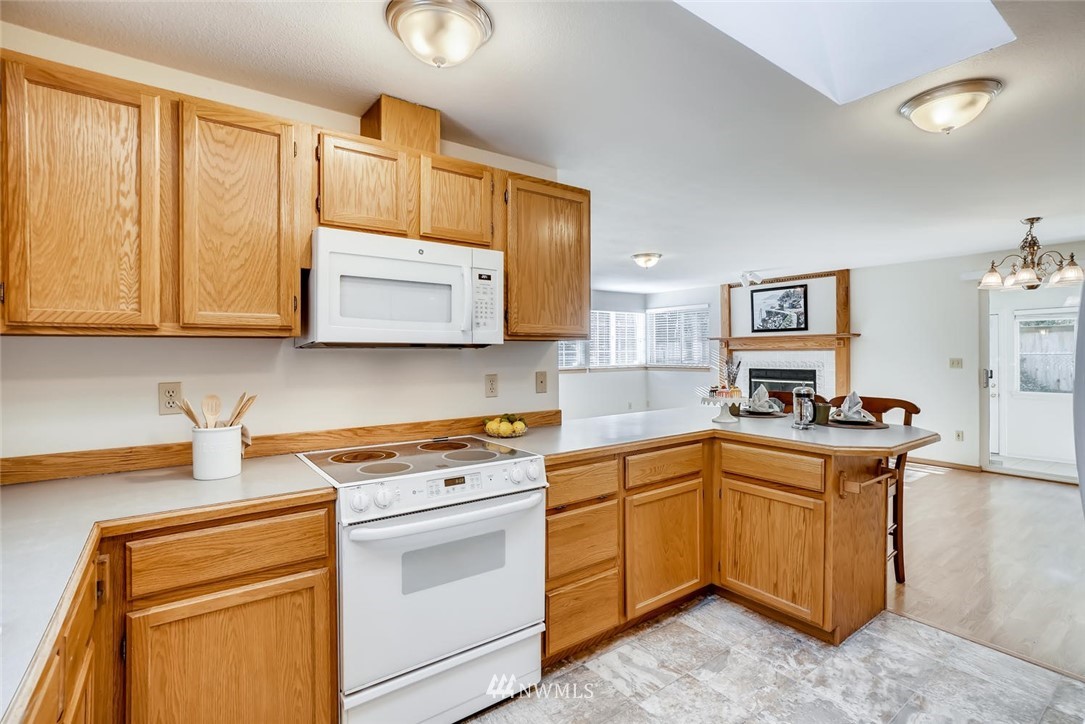 22007 4th Avenue Southeast Bothell, WA 98021 - Photo 8 of 22 a kitchen with stainless steel appliances granite countertop a stove and a sink