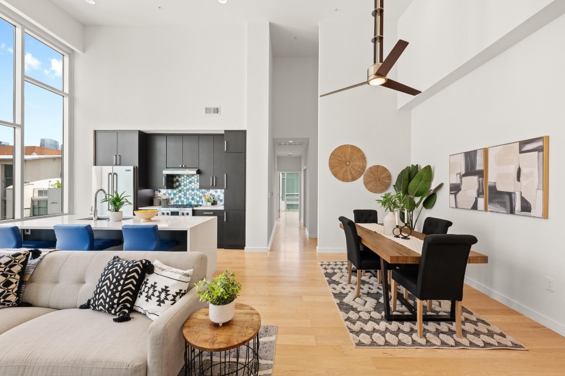 1600 Barton Springs Road, Unit 5601 Austin, TX 78704 - Photo 13 of 36 a living room with furniture and wooden floor