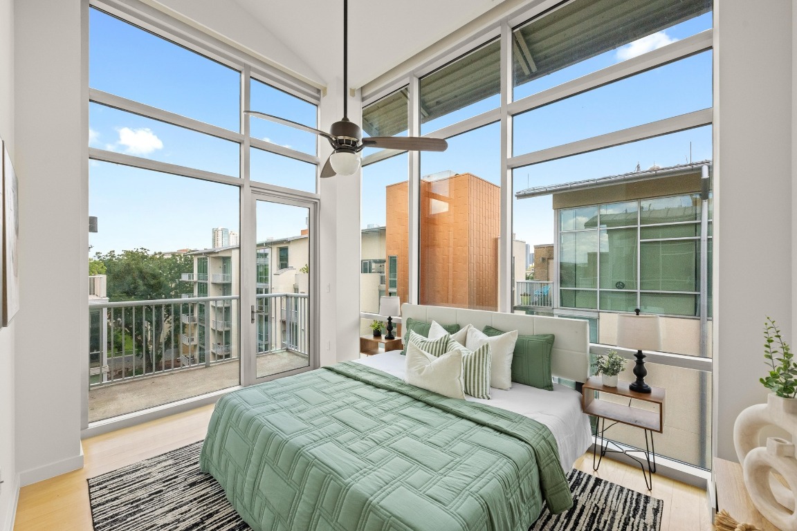 1600 Barton Springs Road, Unit 5601 Austin, TX 78704 - Photo 14 of 36 a bedroom with a bed and a window