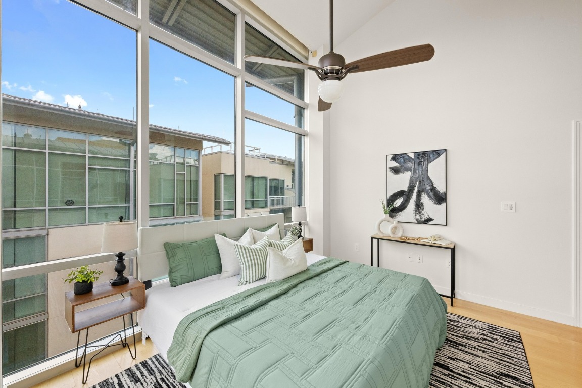 1600 Barton Springs Road, Unit 5601 Austin, TX 78704 - Photo 15 of 36 a bedroom with a bed and a window