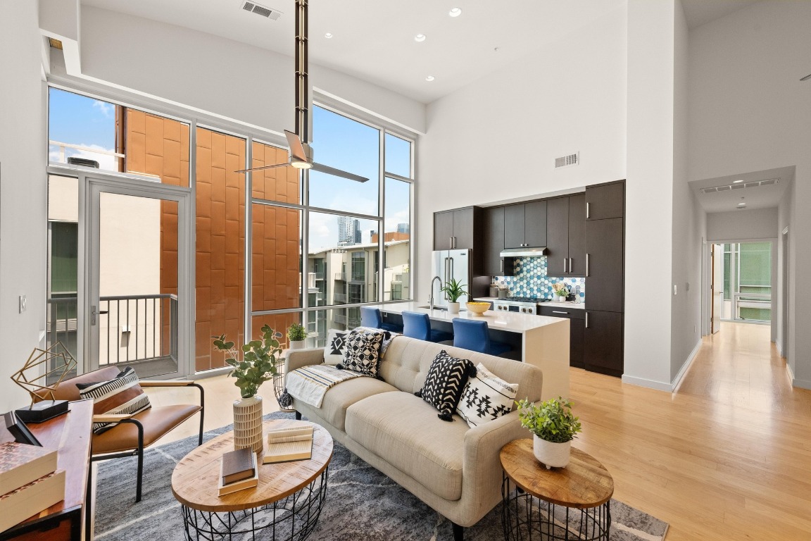 1600 Barton Springs Road, Unit 5601 Austin, TX 78704 - Photo 2 of 36 a living room with furniture and a large window