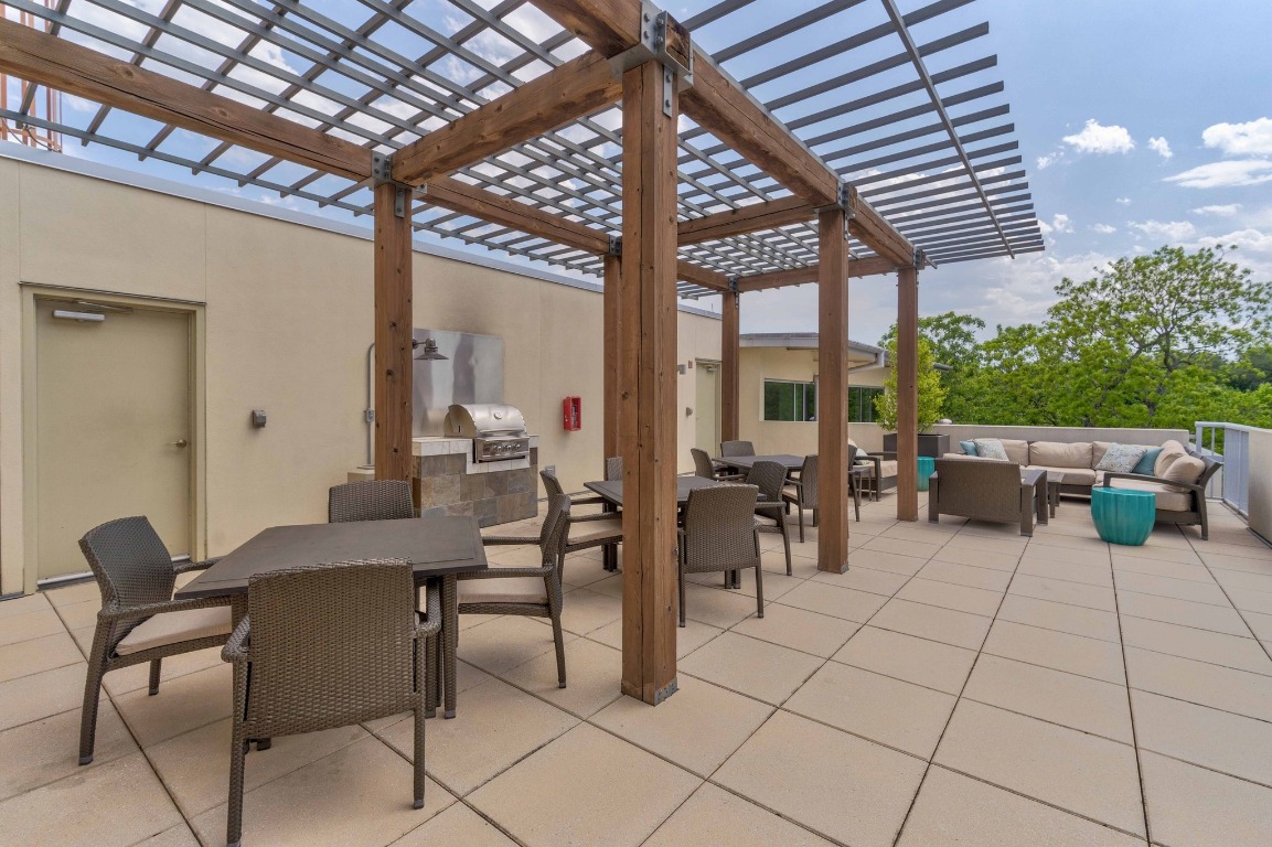 1600 Barton Springs Road, Unit 5601 Austin, TX 78704 - Photo 31 of 36 a outdoor space with lots of tables a garden view and chairs