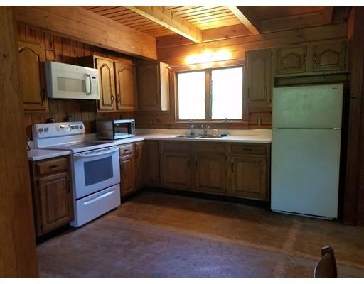 74 Watatic Mountain Road Ashby, MA 01431 - Photo 19 of 35 a kitchen with stainless steel appliances granite countertop a sink stove and refrigerator