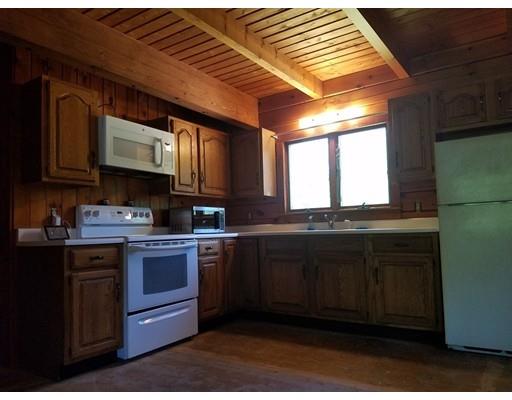 74 Watatic Mountain Road Ashby, MA 01431 - Photo 20 of 35 a kitchen with stainless steel appliances granite countertop a stove a sink and a microwave