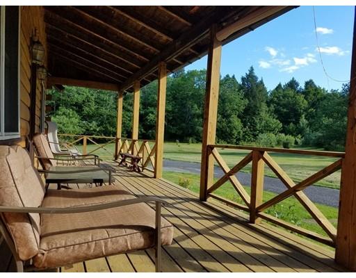 74 Watatic Mountain Road Ashby, MA 01431 - Photo 2 of 35 a view of a chairs and table in the balcony