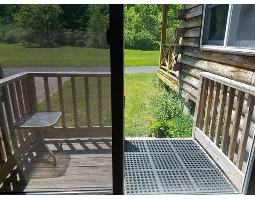 74 Watatic Mountain Road Ashby, MA 01431 - Photo 23 of 35 a view of a porch with a yard