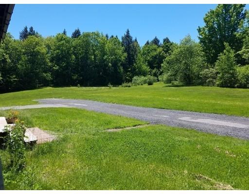 74 Watatic Mountain Road Ashby, MA 01431 - Photo 26 of 35 a view of a golf course with a lake
