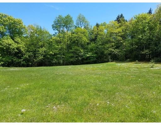 74 Watatic Mountain Road Ashby, MA 01431 - Photo 27 of 35 a view of a garden with a building in the background
