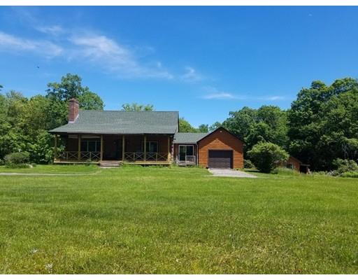 74 Watatic Mountain Road Ashby, MA 01431 - Photo 3 of 35 a front view of a house with a garden