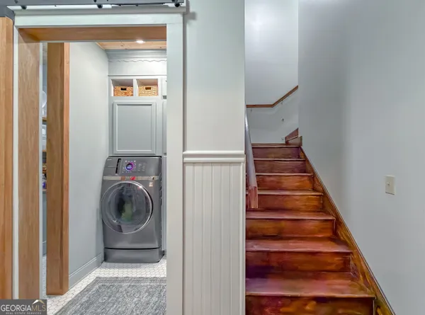 a bathroom with a glass shower door