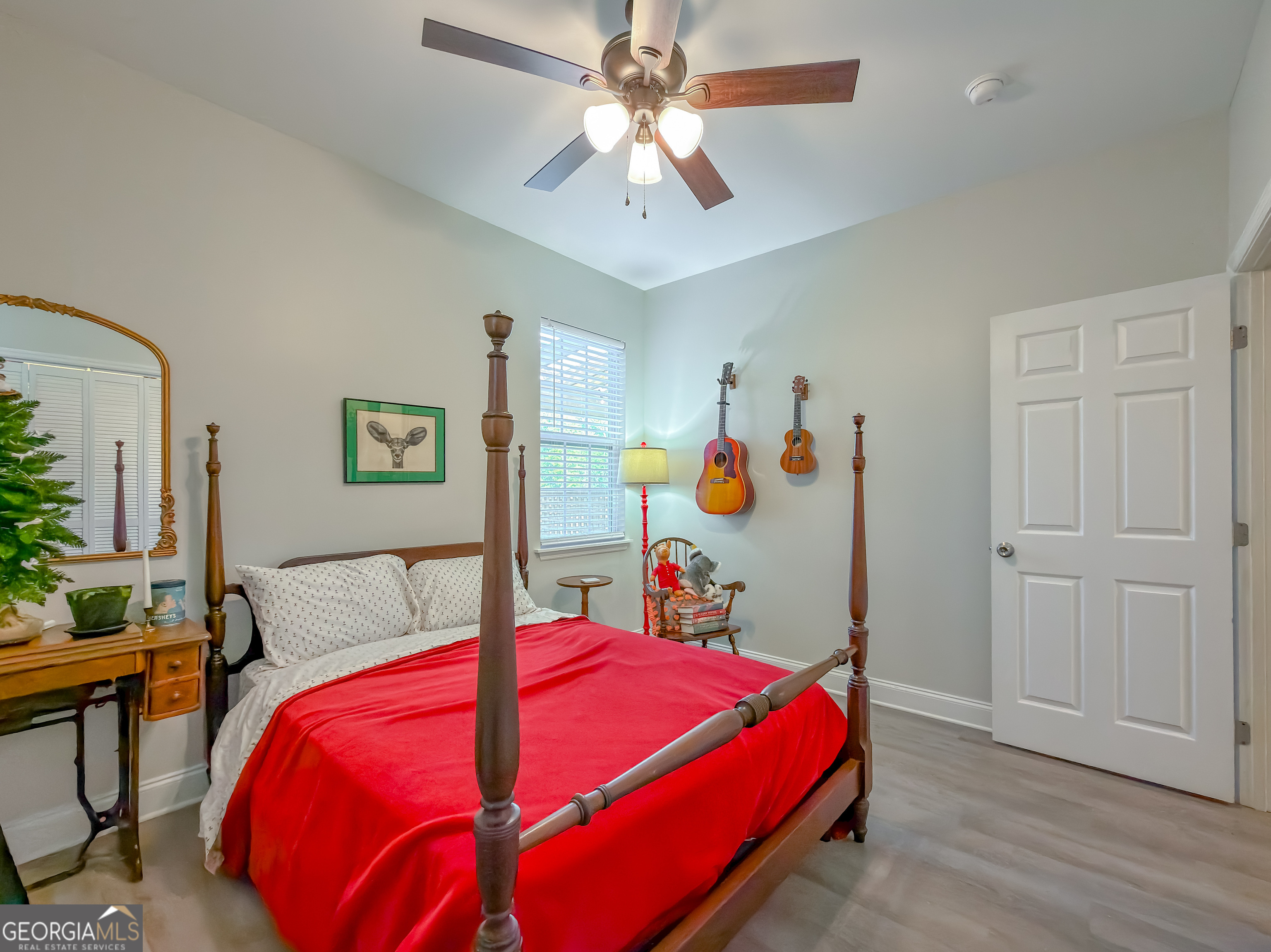 100 Robin Lane Bainbridge, GA 39819 - Photo 38 of 74 a bedroom with a bed and a chandelier