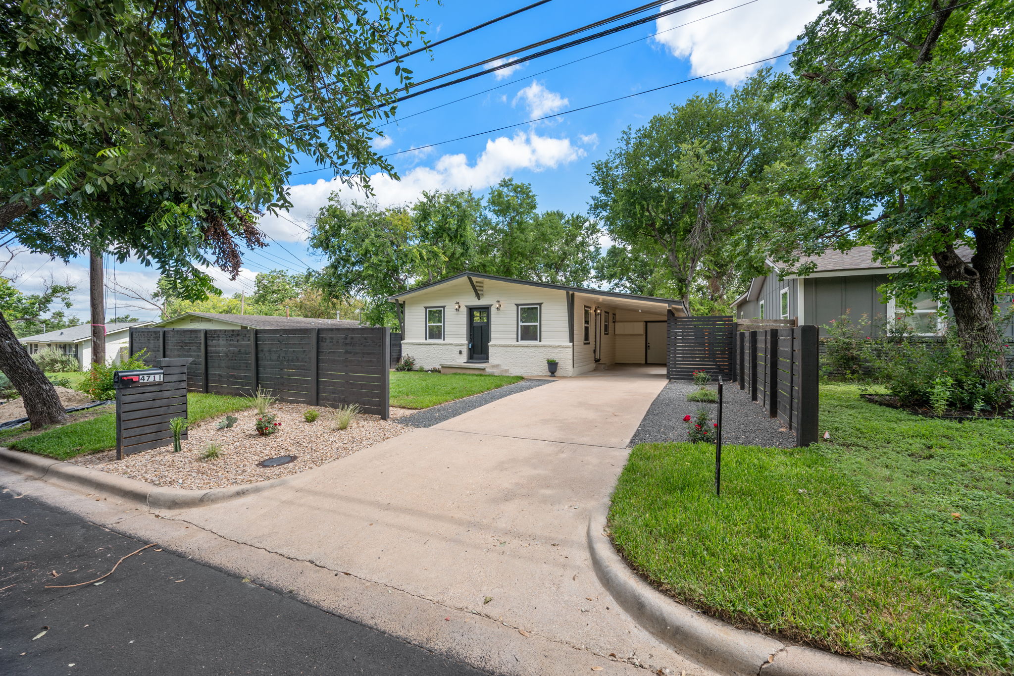4711 Bandera Road Austin, TX 78721 - Photo 21 of 22 a view of a house with backyard and a tree