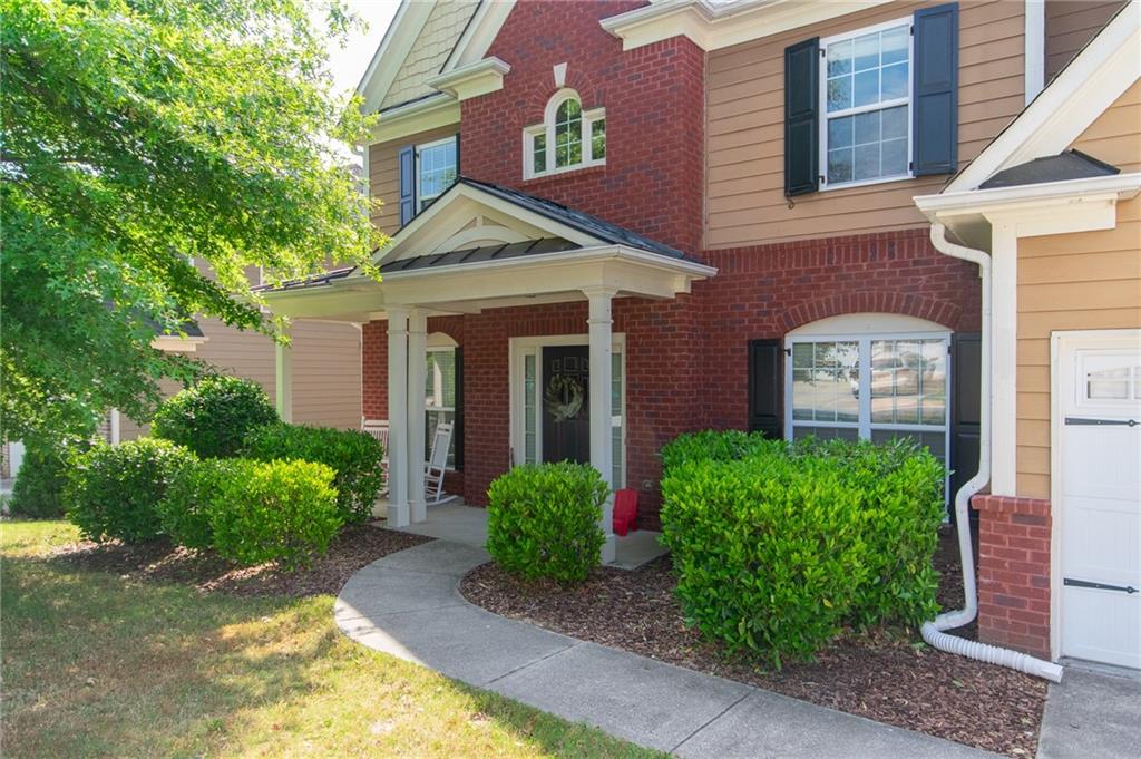 1012 Landon Drive Villa Rica, GA 30180 - Photo 1 of 1 a front view of a house with garden