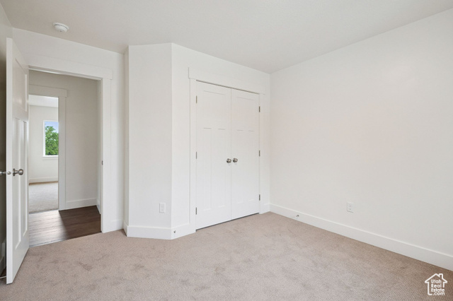 1615 North Angel Street, Unit I Layton, UT 84041 - Photo 24 of 56 Unfurnished bedroom with carpet floors and a closet