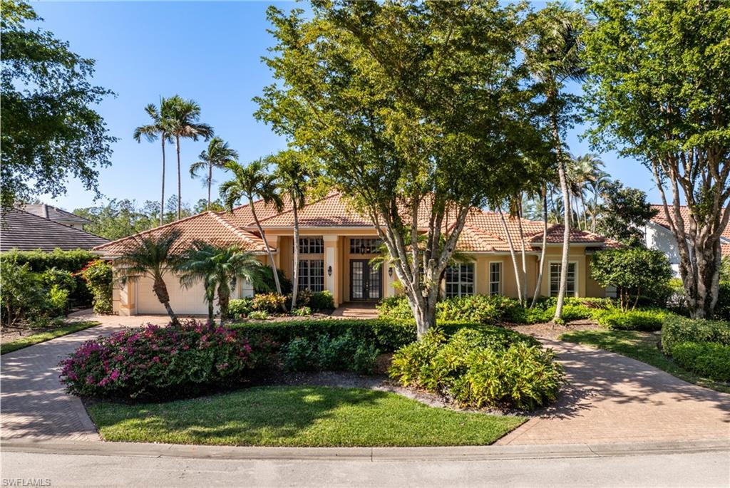 7126 Mill Run Road Naples, FL 34109 - Photo 1 of 49 View of front of property featuring a garage