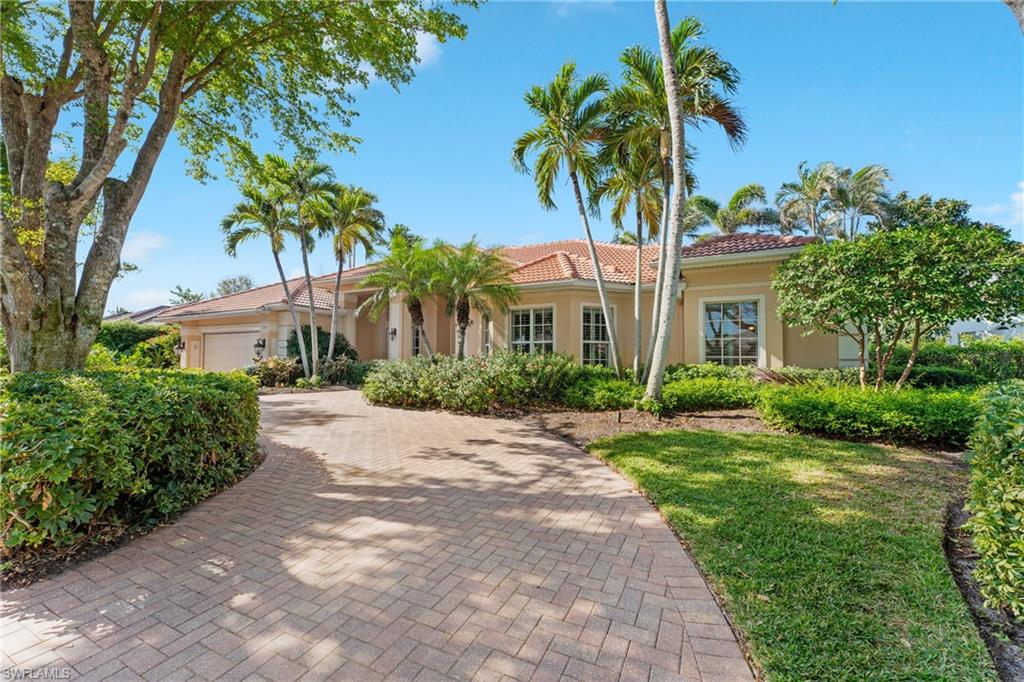 7126 Mill Run Road Naples, FL 34109 - Photo 2 of 49 Mediterranean / spanish-style home with a garage
