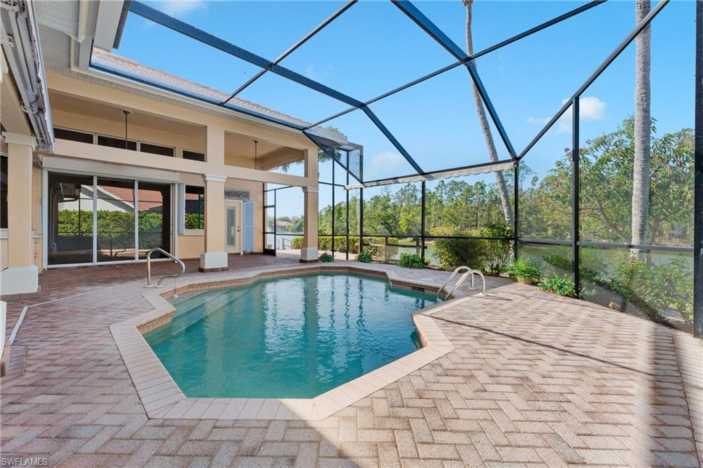 7126 Mill Run Road Naples, FL 34109 - Photo 37 of 49 View of pool with ceiling fan, a lanai, and a patio
