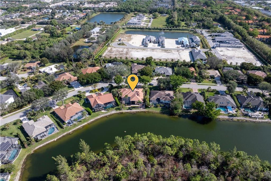 7126 Mill Run Road Naples, FL 34109 - Photo 46 of 49 Drone / aerial view featuring a water view