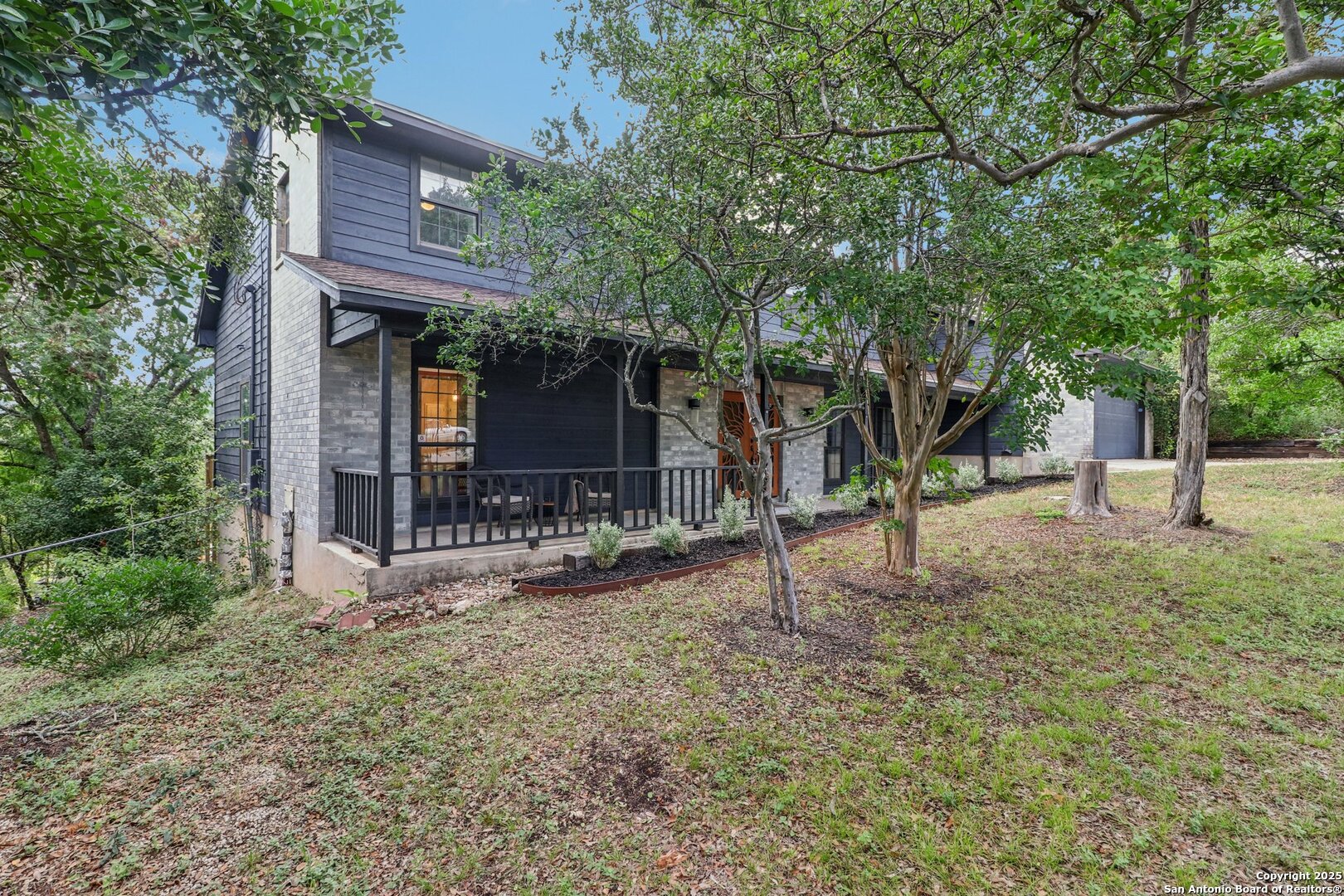 20211 County Road 174 Helotes, TX 78023 - Photo 11 of 45 a front view of a house with a yard