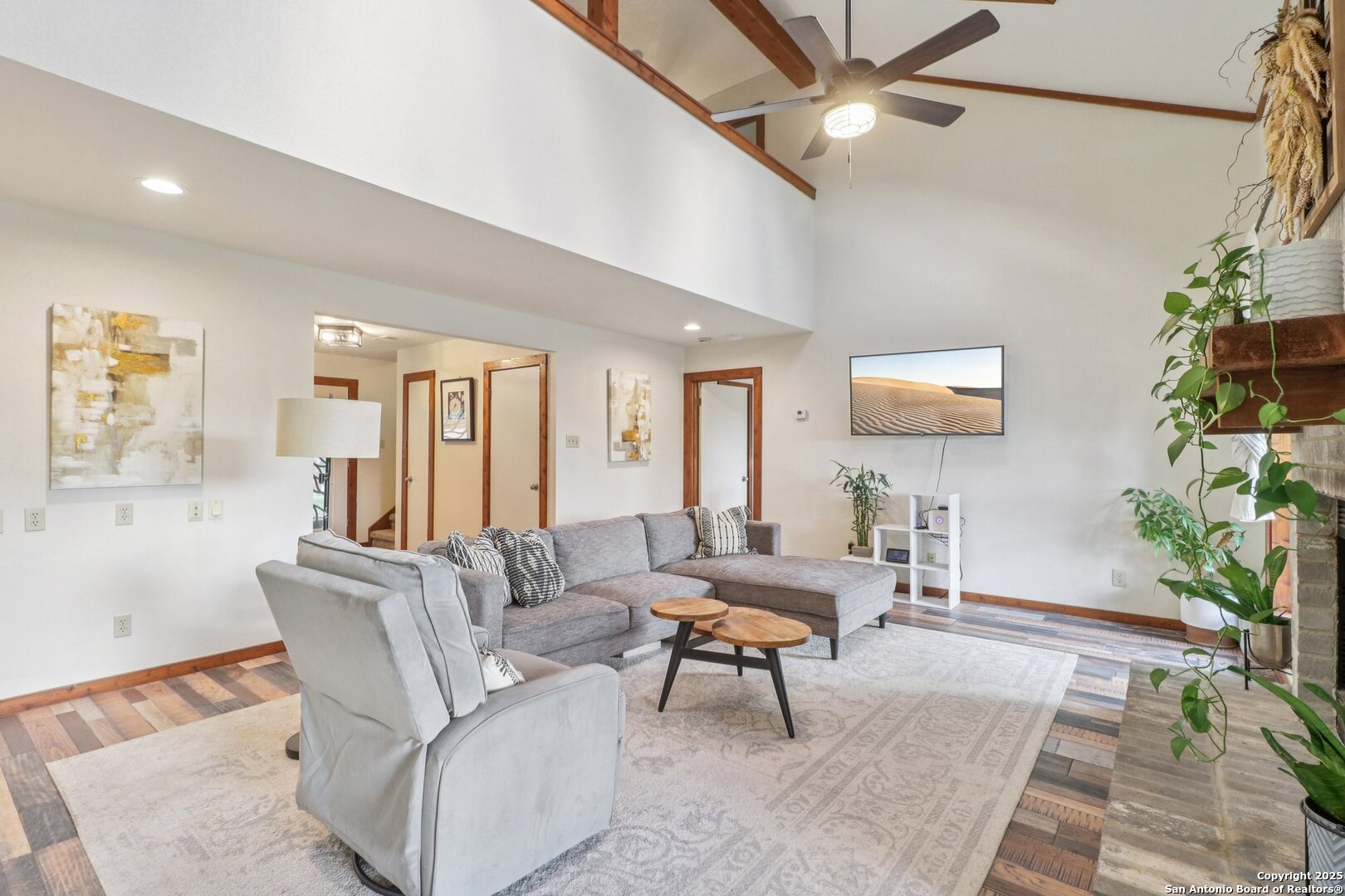 20211 County Road 174 Helotes, TX 78023 - Photo 14 of 45 a living room with furniture and a flat screen tv