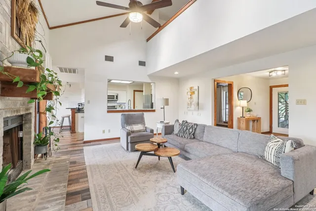 a living room with furniture and a fireplace