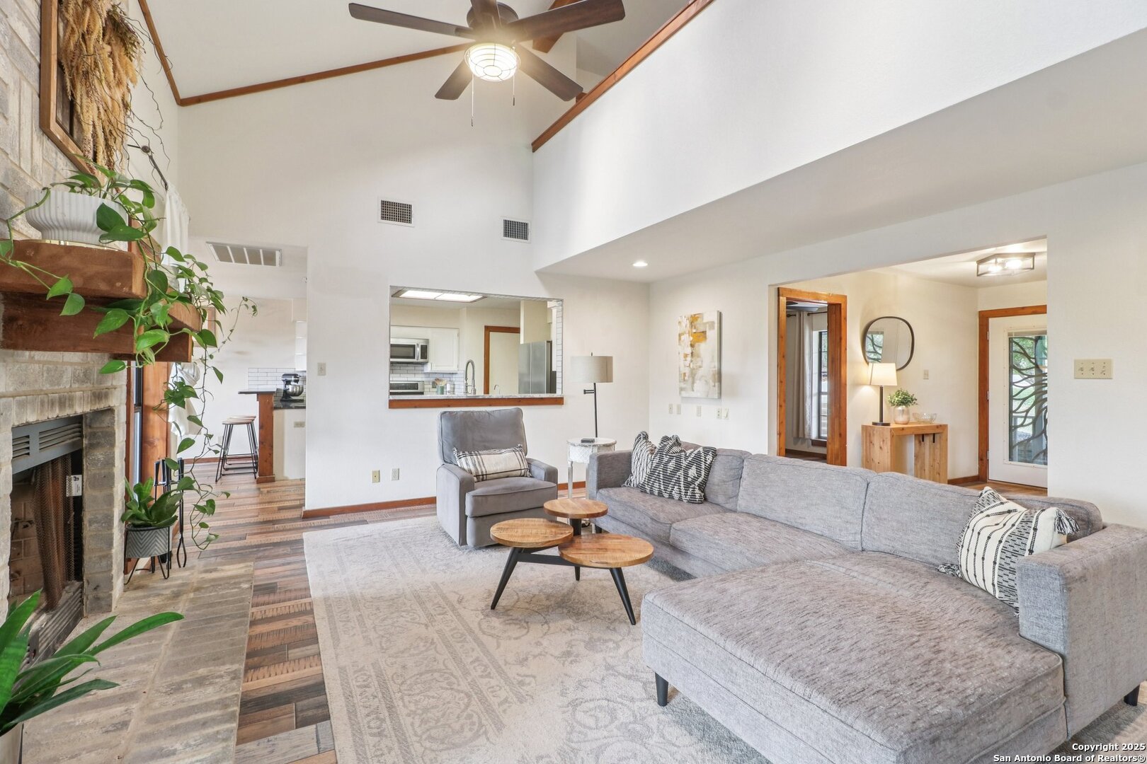 20211 County Road 174 Helotes, TX 78023 - Photo 15 of 45 a living room with furniture and a fireplace