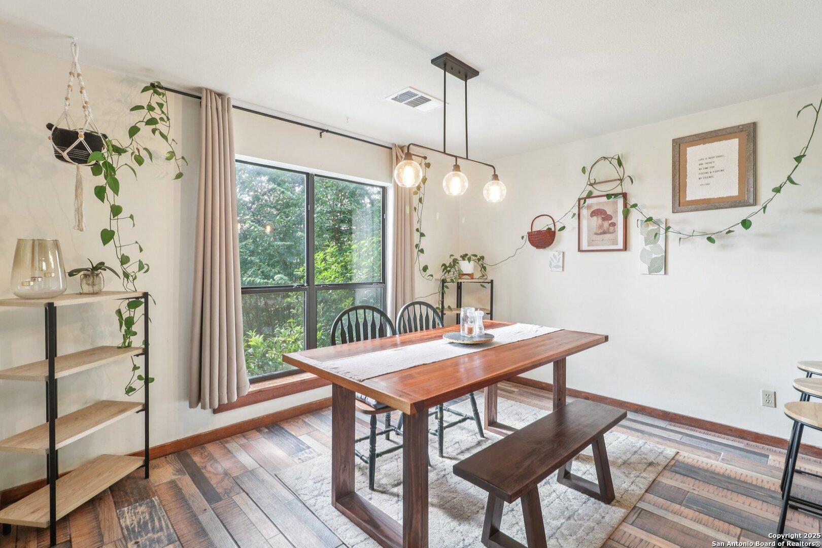 20211 County Road 174 Helotes, TX 78023 - Photo 16 of 45 a view of a dining room with furniture window and wooden floor