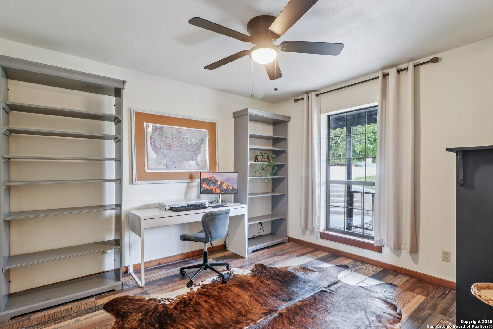 20211 County Road 174 Helotes, TX 78023 - Photo 22 of 45 a view of a livingroom with workspace and a window