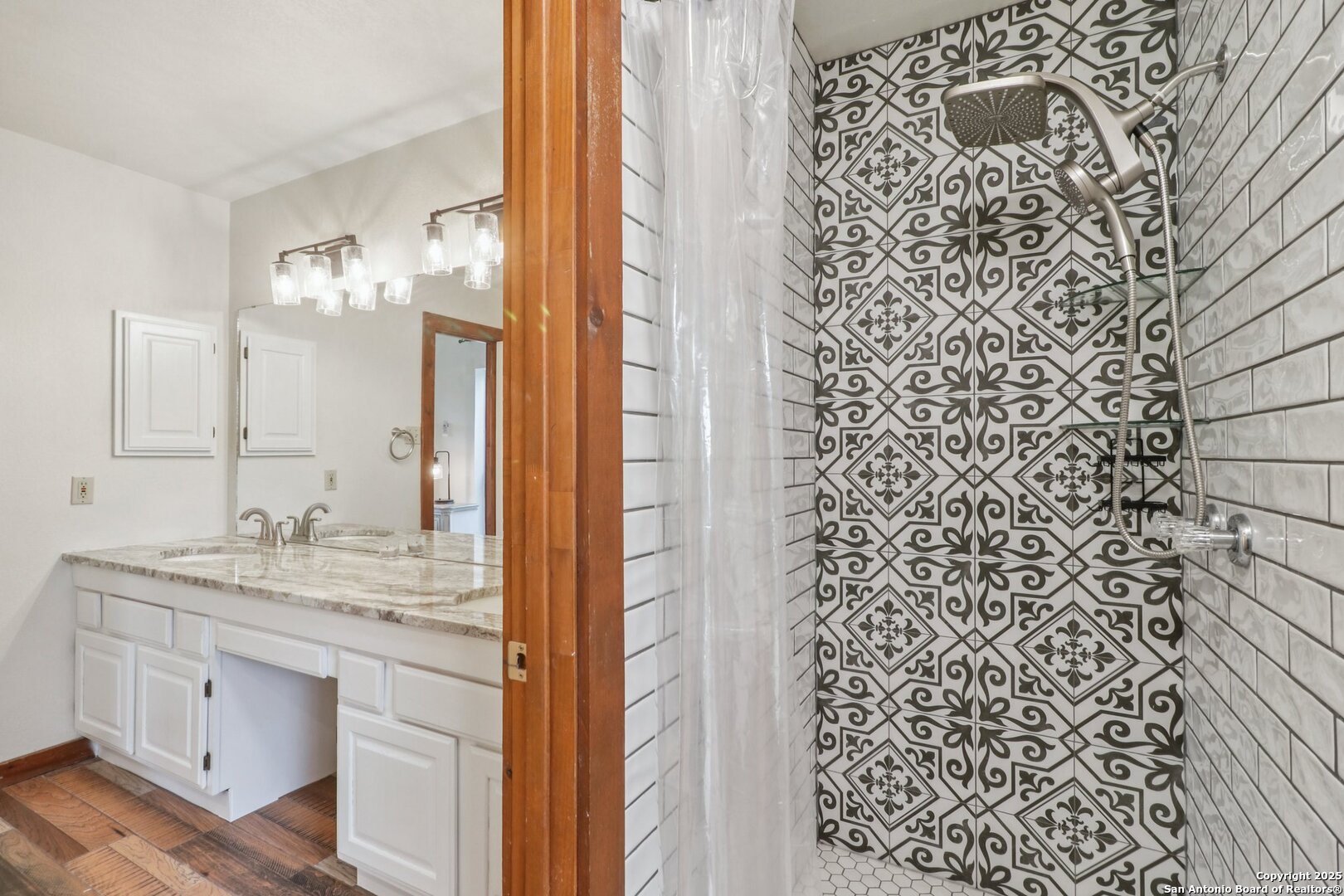 20211 County Road 174 Helotes, TX 78023 - Photo 28 of 45 a bathroom with a granite countertop sink a toilet and a mirror