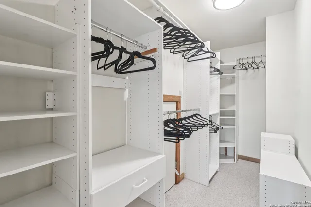 a kitchen with a refrigerator and a stove