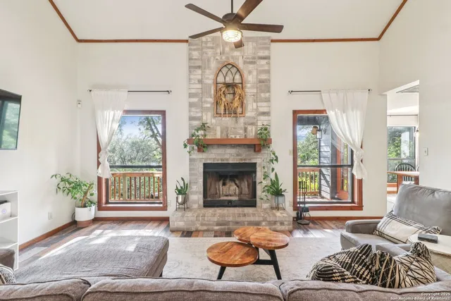 a living room with furniture and a fireplace