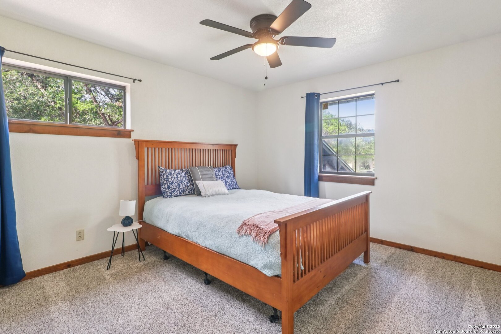 20211 County Road 174 Helotes, TX 78023 - Photo 34 of 45 a bedroom with a bed and window