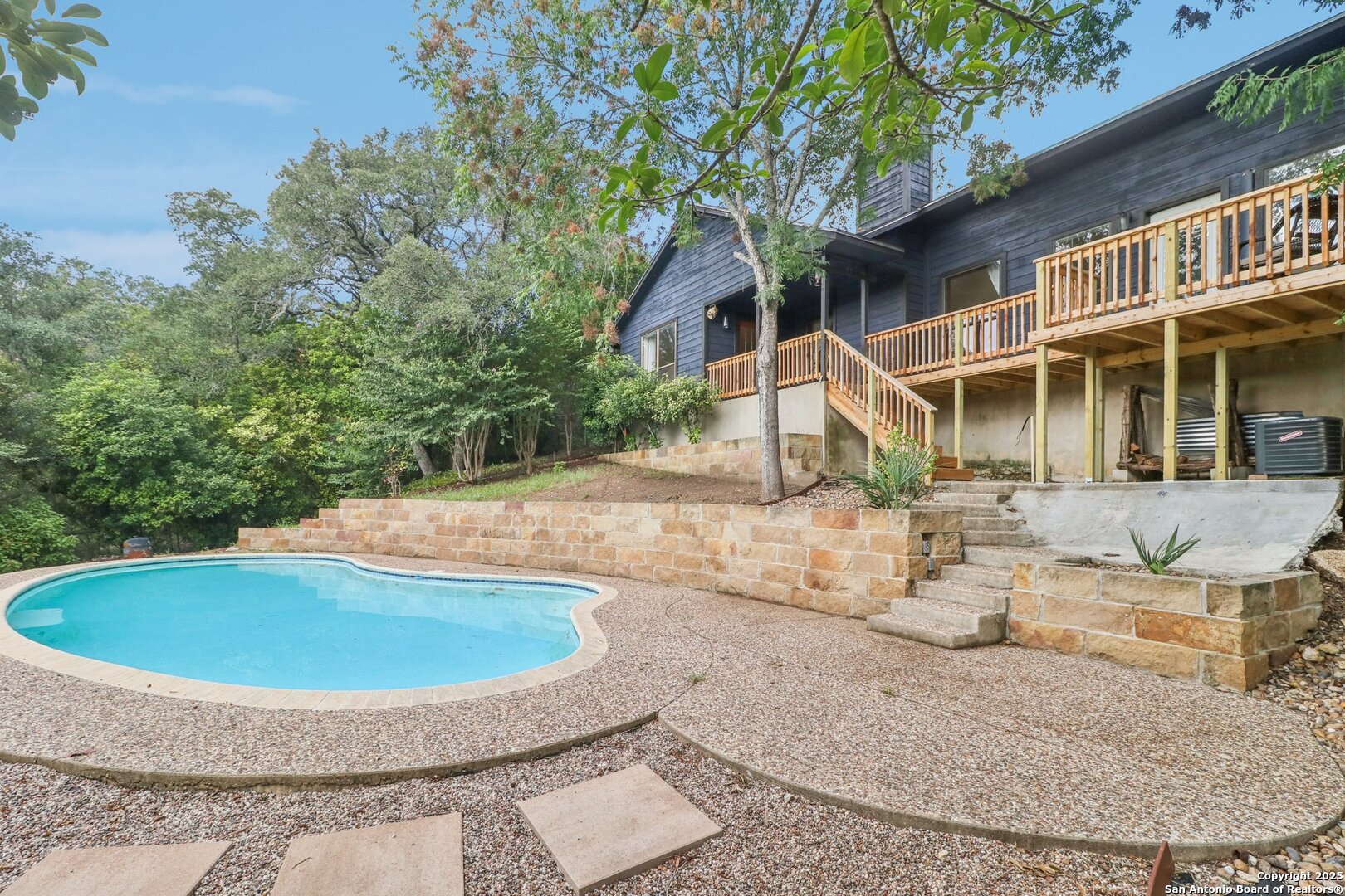 20211 County Road 174 Helotes, TX 78023 - Photo 41 of 45 a view of a house with backyard and sitting area