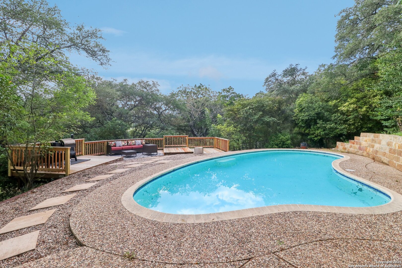 20211 County Road 174 Helotes, TX 78023 - Photo 7 of 45 a view of a swimming pool with a patio