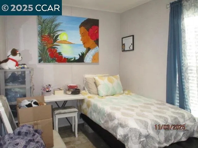 a bedroom with a bed and furniture