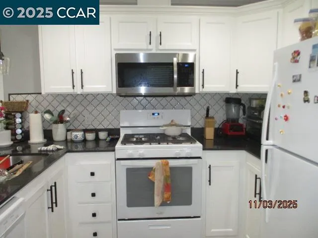 a kitchen with a stove and a microwave