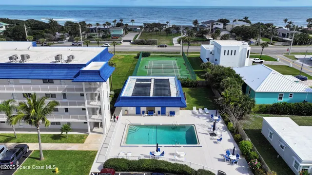 a view of a swimming pool with a lounge chairs