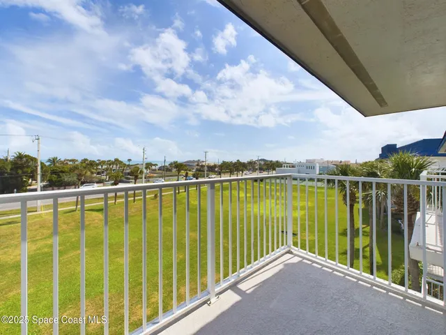 a view of a lake from a balcony