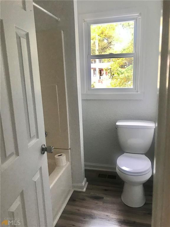 116 Edwards Street Bremen, GA 30110 - Photo 25 of 33 a white toilet sitting next to a bathroom sink