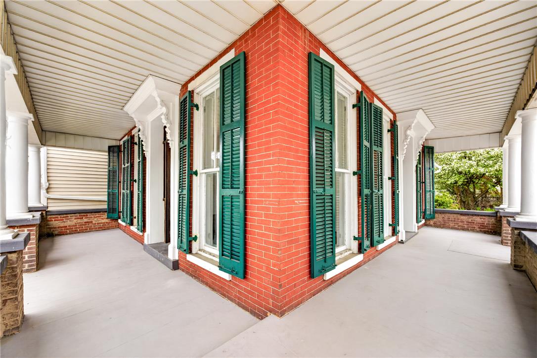 65 2nd Street Slatington, PA 18080 - Photo 5 of 46 This porch features classic brickwork, sturdy white columns, and charming green shutters.