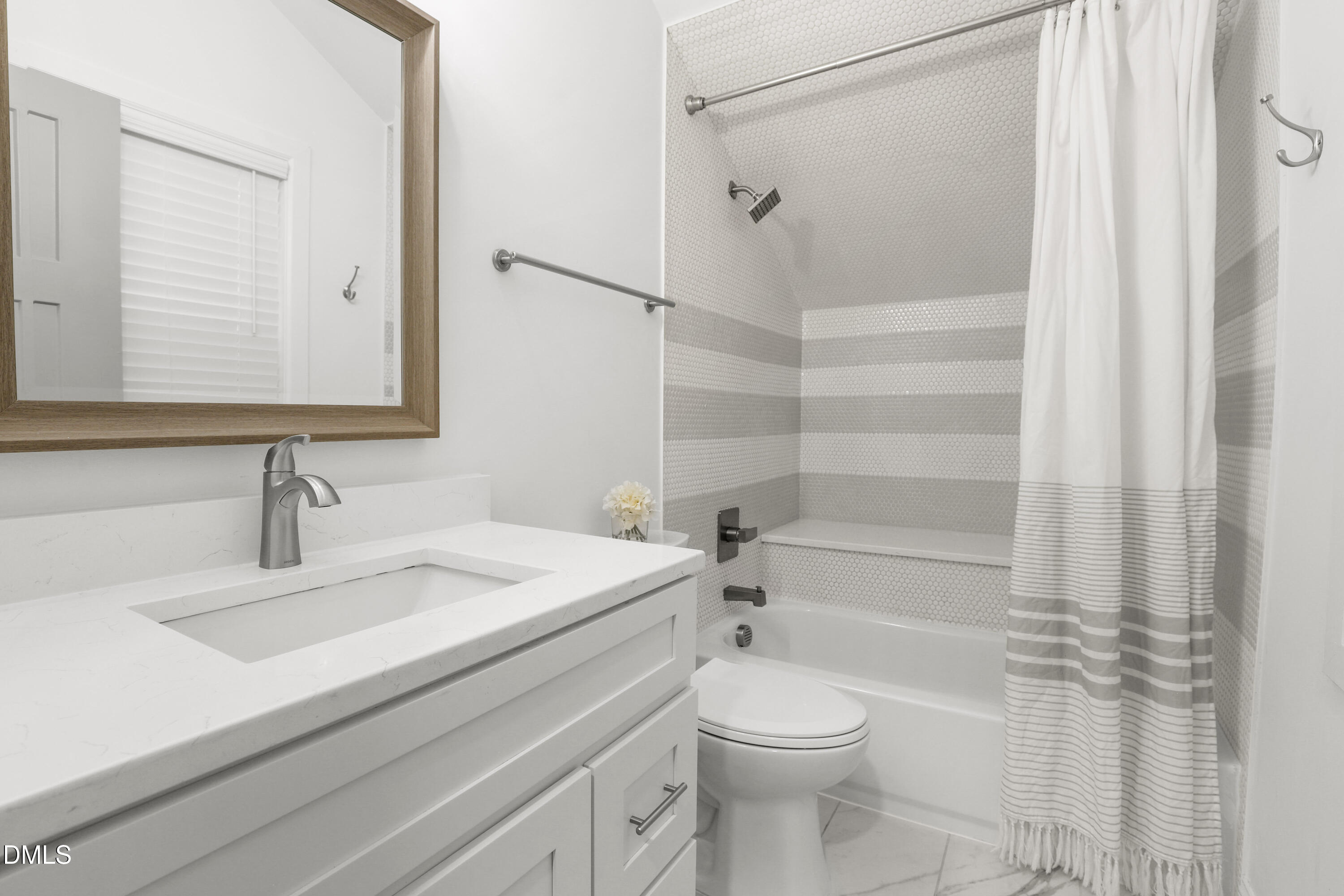 1217 Rosedale Avenue, Unit B Durham, NC 27707 - Photo 14 of 24 a bathroom with a sink a toilet and shower