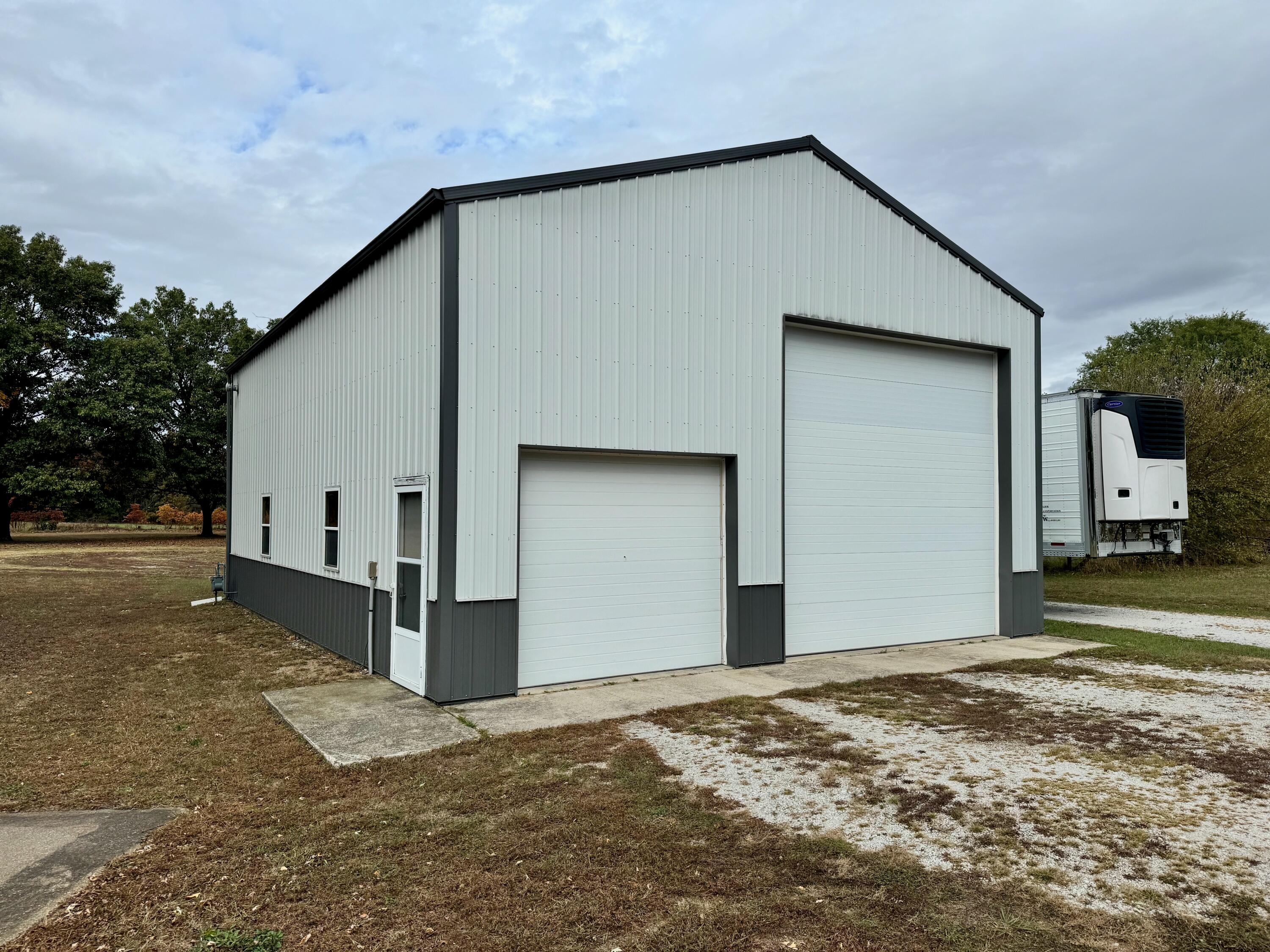 2720 South Toto Road North Judson, IN 46366 - Photo 15 of 17 a front view of a house with a yard and garage