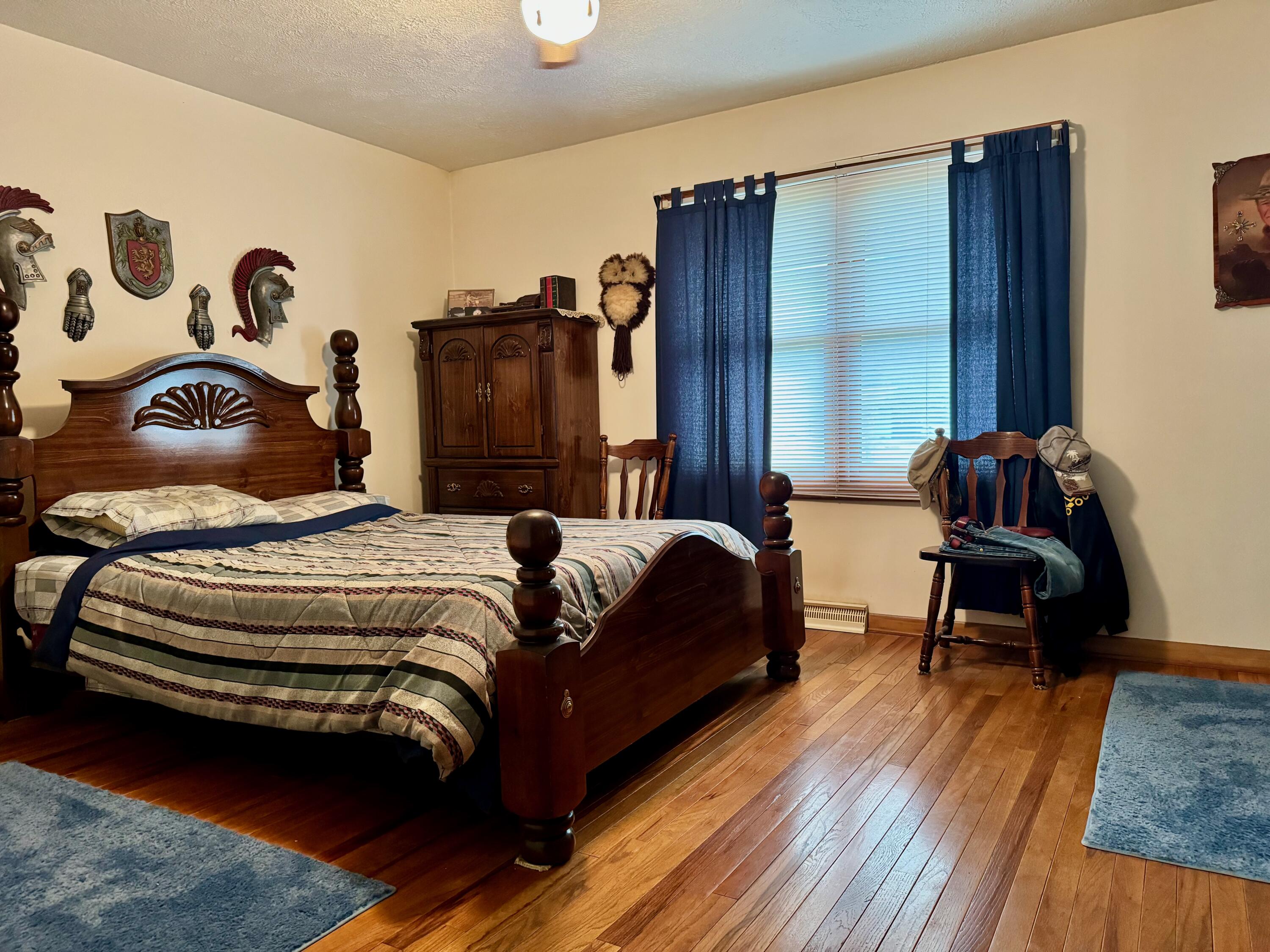 2720 South Toto Road North Judson, IN 46366 - Photo 8 of 17 a bedroom with a bed and a chair