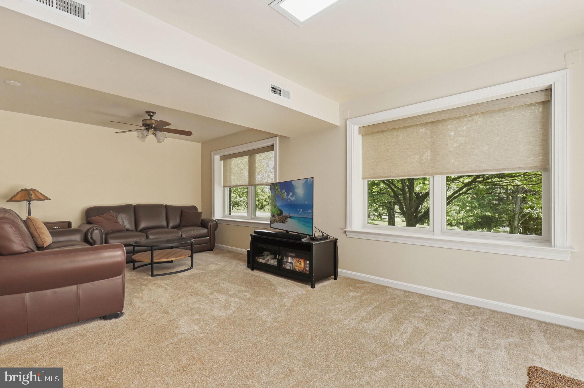 6336 Boyers Mill Road New Market, MD 21774 - Photo 27 of 49 a living room with furniture and a flat screen tv